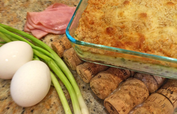 Chicken cordon bleu bake with eggs, ham, and green onions.