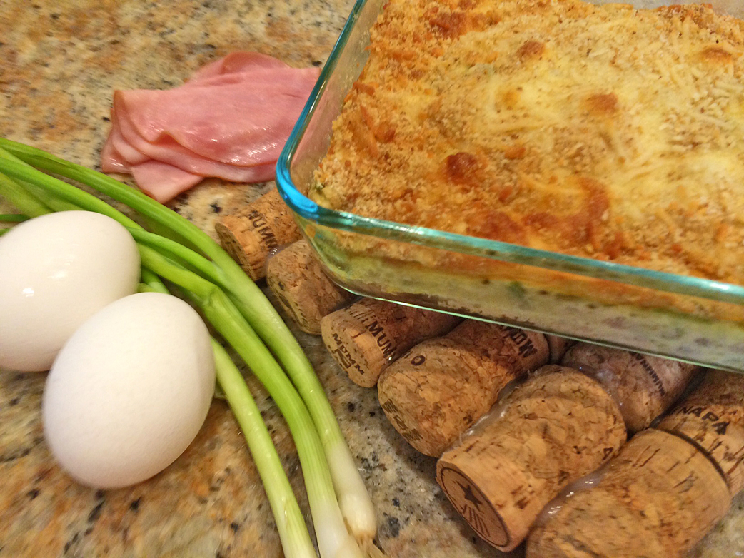 Chicken cordon bleu bake with eggs, ham, and green onions.