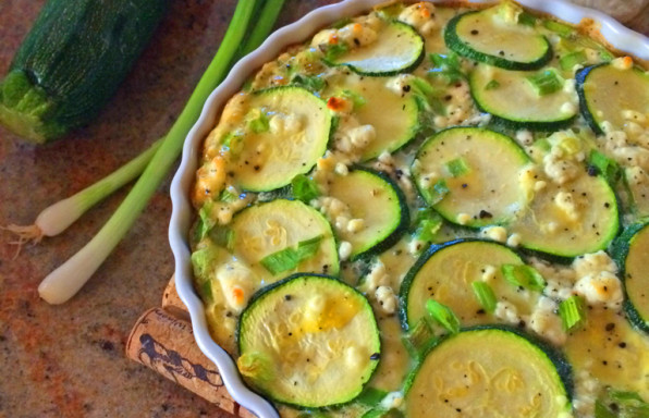 Meatless frittata with zucchini, goat cheese, and green onions.