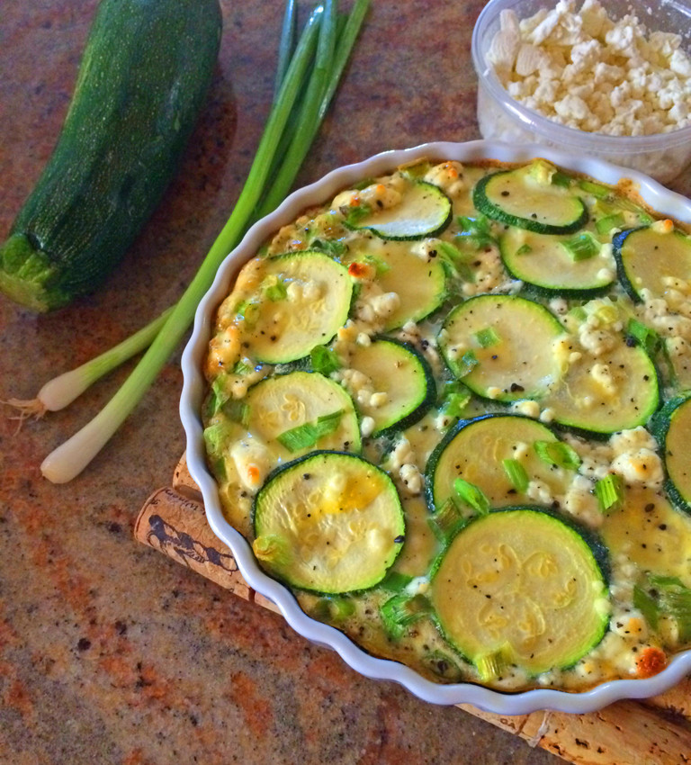 Meatless frittata with zucchini, goat cheese, and green onions.