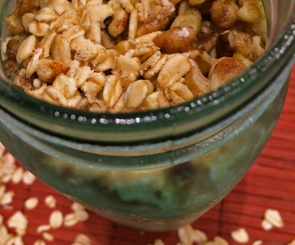 Over night oats in a mason jar with walnuts and blueberries.