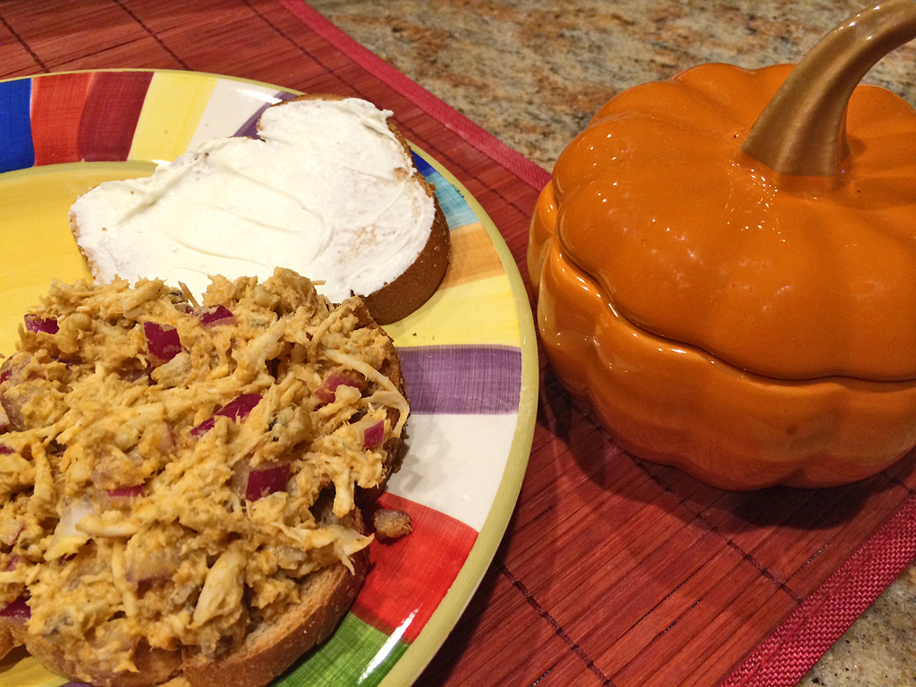 Pumpkin and walnut chicken salad sandwich with cream cheese.