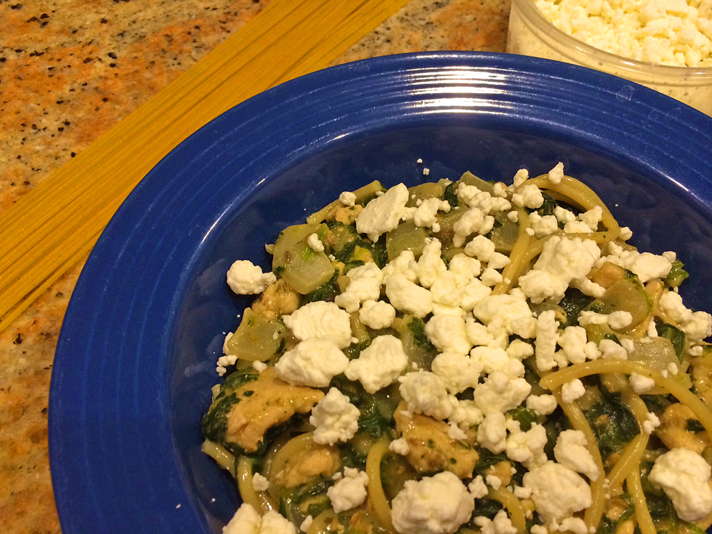 Healthy sausage pasta with spinach, goat cheese, and ground turkey.