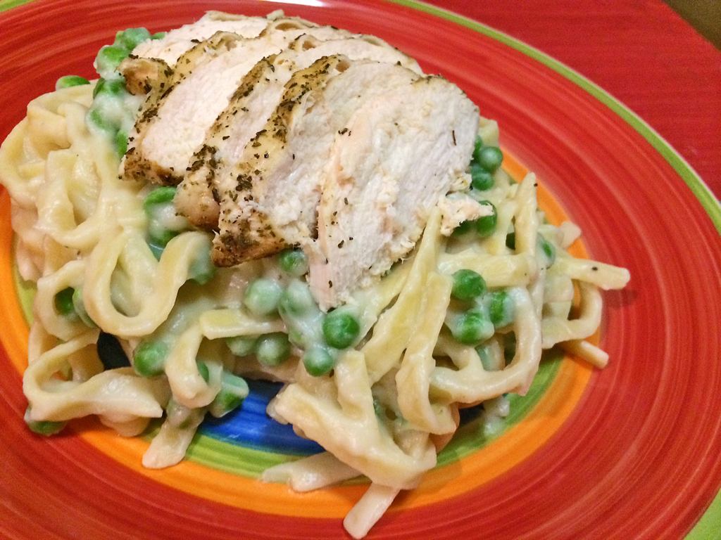 lighter alfredo sauce pasta with chicken and peas.