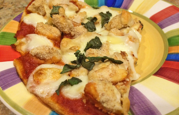 Parmesan Chicken Pizza Toppings including crusted chicken, basil, and cheese.