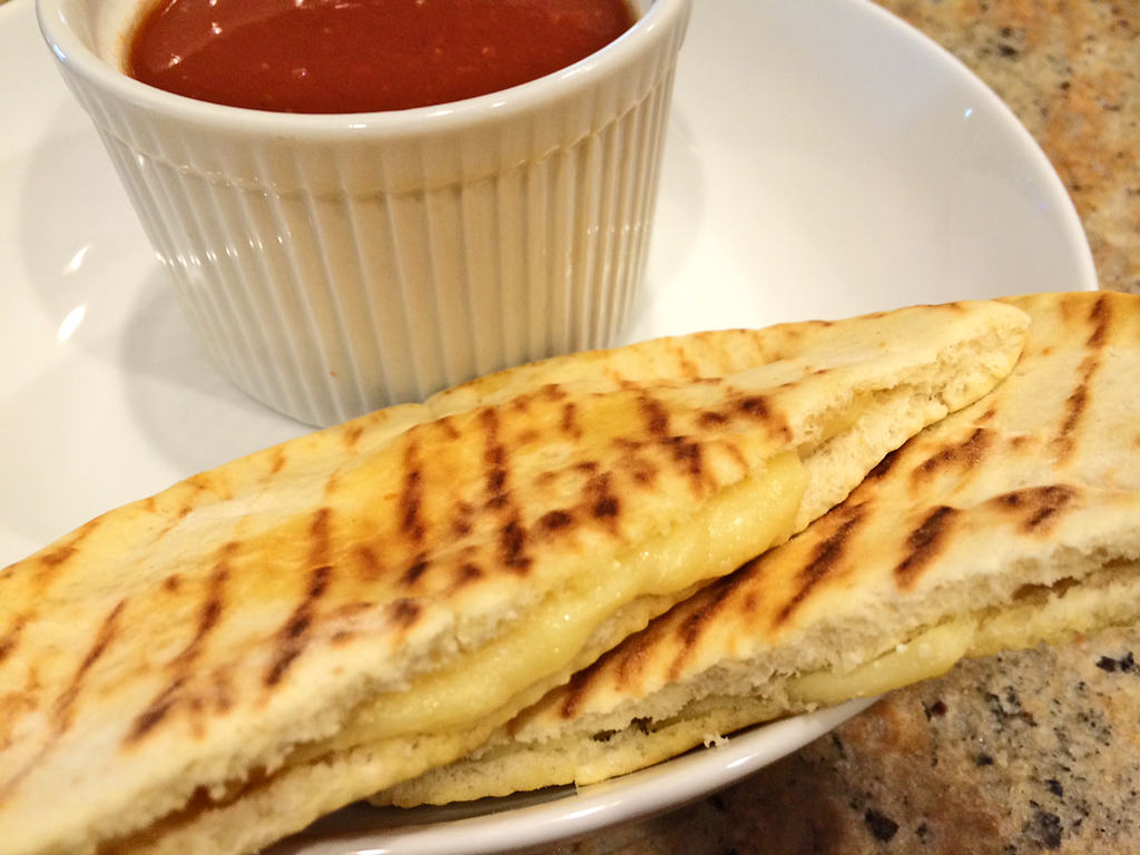 Pocket Bread Grilled Cheese with pita, cheese, and tomato soup.