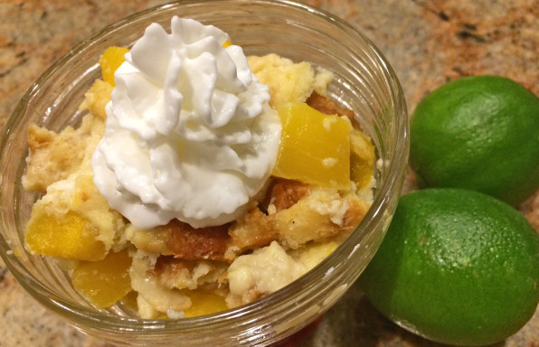 Tropical Bread Pudding for Two with mago, limes, and whipped cream.