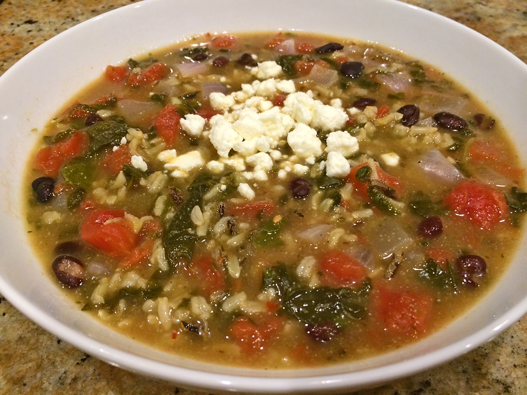 Black beans and wild rice soup with tomatoes and feta cheese.