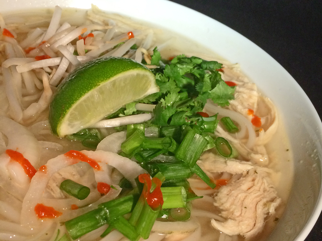 Easy Pho Ga with chicken, green onions, and lime.